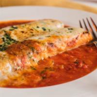 Canneloni Di Carne · Rolled sheets of pasta filled with prime beef in a tomato cream sauce and topped with Mozzar...