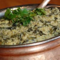 Chicken Saag · Chicken simmered in pureed spinach, tomatoes and finished with cream,