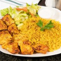 Chicken Kabob · Marinated grilled chicken, served with rice, a side of salad, yogurt sauce and pita bread.