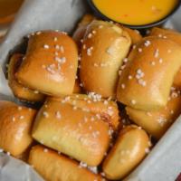 Pretzel Bites · Warm, fresh, bites served with our homemade cheese sauce.