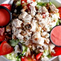 Devney'S Strawberry Fields Chicken Salad · A bed of mixed greens with grilled chicken, strawberry wedges, candied pecans, feta cheese a...