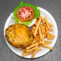 Cheeseburger · Grilled 8 oz. Angus ground beef patty with melted cheddar, lettuce, tomato, and fries.