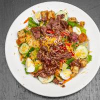Cav’S Favorite Salad · Grilled filet mignon tips and cheddar cheese over crisp romaine with tomatoes, carrots, pepp...
