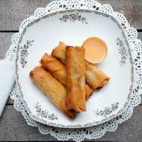 Egg Rolls · Four deep-fried egg rolls wrapped in wonton paper, filled with pork, shrimp, carrot, and gla...