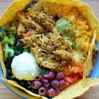 Tacoz Bowl  Topped With Marinated Meat Or Plant-Based Option · Comes with rice, black beans, your choice of marinated meat, and is topped with chips
