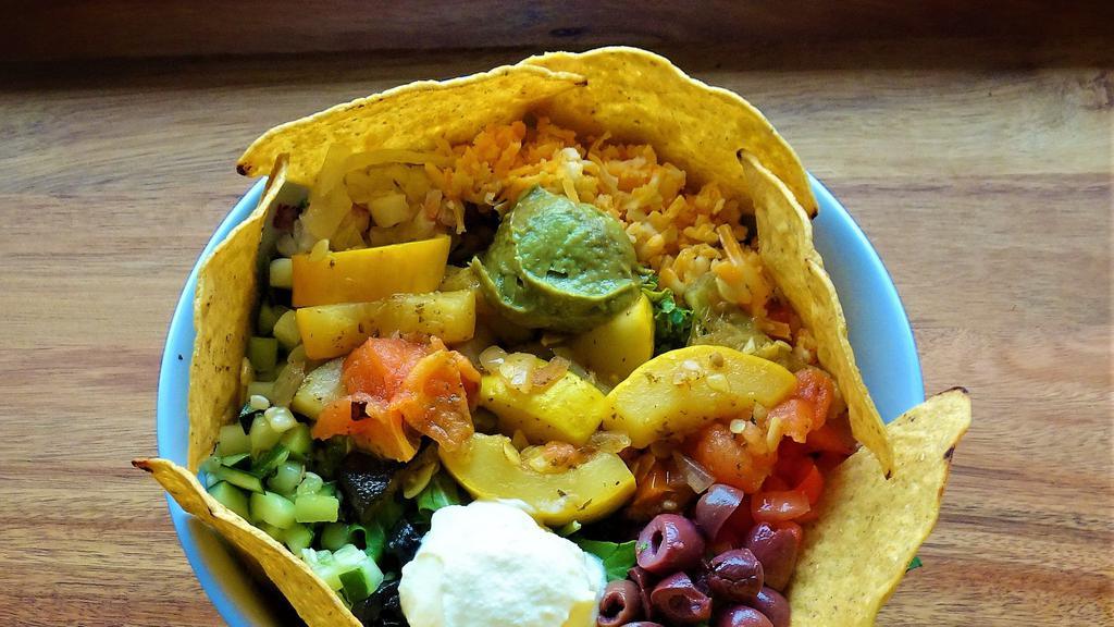Veggie Tacoz Bowl · Comes with rice, black beans, your choice of a veggie, toppings, and topped with chips