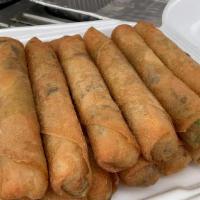 Eggroll (Dozen) · Authentic freshly rolled Egg Rolls filled with Ground Pork, Vermicelli Noodles, and Veggies,...