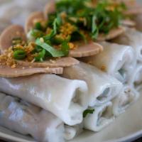 Steams Rolls (Dozen) · Savory steamed rice rolls filled with seasoned ground pork and green onions. Served with a s...