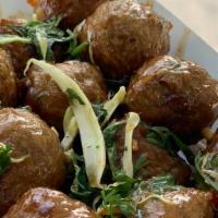 Meatballs On A Stick  · Deep fried Beef Meatballs drenched in our THICK sweet sauce topped off with sliced cabbage a...
