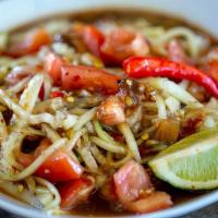 Cucumber Salad · Juicy shredded Cucumber mixed with sliced Thai eggplants and diced tomatoes. All drenched in...