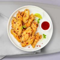 Illy Chili Vegan Wings · (6 pieces) Fresh vegan chicken wings breaded, fried until golden brown, and tossed in sweet ...