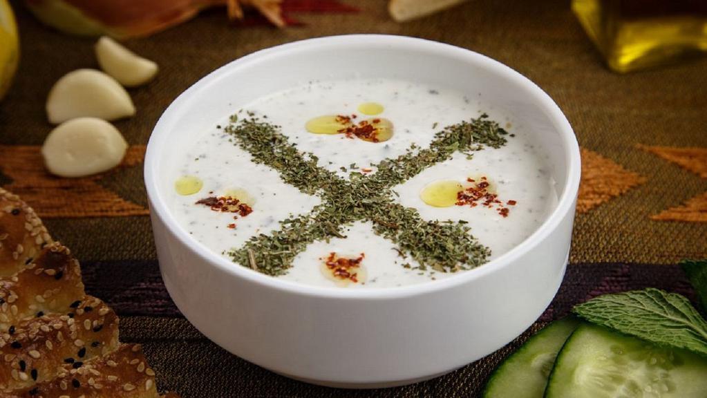 Cacık (Jajik) · Gluten-free, vegetarian. Home-made yogurt specially prepared with chopped cucumber, fresh garlic and dried mint.