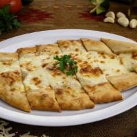 Peynirli Pide (Cheese Pide) · Vegetarian. A thick dough crust stuffed with mozzarella.