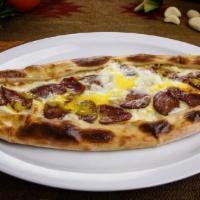 Karιşιk Pide (Mixed Pide) · A thick dough crust stuffed with combination of cheese, eggs, Turkish sausage and pastirma.