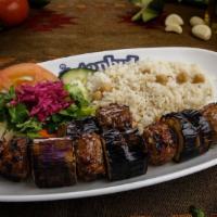 Patlıcan (Eggplant) Kebab · Gluten-free. Baby eggplant sliced in round and threaded on a skewer, separated with marinate...