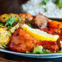 Tandoori Mixed Grill · A combination of our appetizing tandoori chicken, seekh kabab, shrimp tandoori, boti kabab, ...