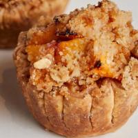 Peach Crumb · Fresh Peaches baked with brown sugar, cinnamon and ginger + topped with our in house crumb t...