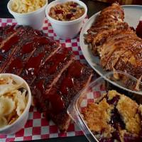 Family Meal Deal · One full Texas oak-smoked rack of ribs, one lb of pulled pork or chicken with any six sides ...