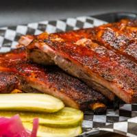 Pork Ribs Full Rack · One full rack of our Texas oak smoked ribs.
