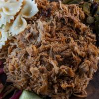 Pulled Chicken Meal · Texas oak smoked pulled chicken with any two sides of your choice.