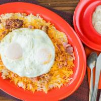Travis Skillet · hash browns, ham, sausage, bacon, cheddar cheese, topped with two eggs and sausage gravy.) (...