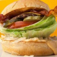 Texas Cheeseburger · BBQ Sauce, Onion Rings, Lettuce, Tomatoes, Bacon, Swiss and American Cheese