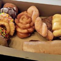 Dozen Mixed Special · Your choice of 6 Classic Donuts, 3 Fancies and 3 Rolls to complete the dozen.
