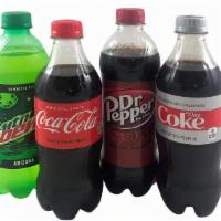 Soda · 16.9 OZ bottles of Coca-Cola, Diet Coke, Dr Pepper, and Mtn Dew.