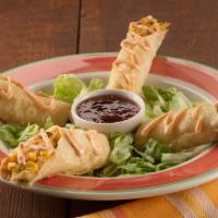 Flautas · Lightly crispy hand-rolled flour tortillas filled with seasoned shredded chicken, roasted re...