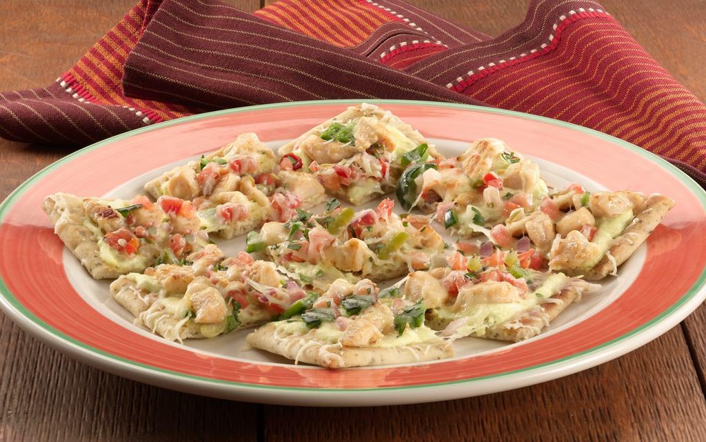 Margarita Chicken Flatbread · Try our golden oven-baked flatbread with creamy fundido sauce, grilled chicken, bacon, fresh poblano peppers, mild Cheddar, Monterey Jack and mozzarella cheese. Topped with pico de gallo and fresh, chopped cilantro.