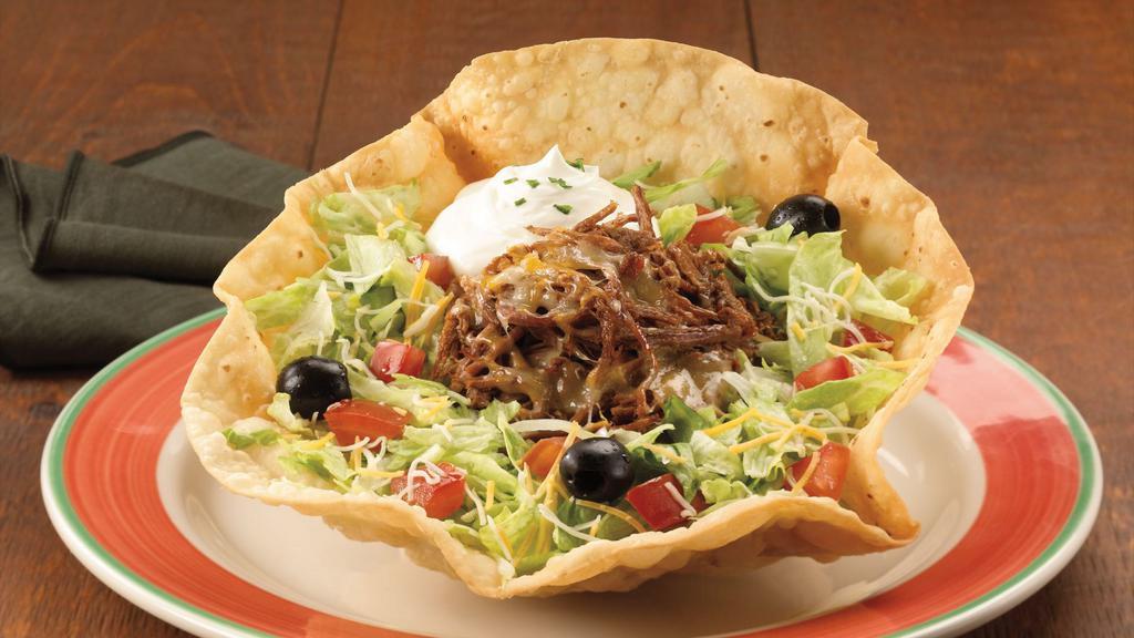 Wild Tostada · Paradiso Specialty. Tame your appetite with this tostada filled with meat mixed with rice and mild Cheddar and Monterey Jack cheese on a crisp tortilla covered with shredded lettuce, tomatoes, black olives and a scoop of sour cream topping. Salad also available on a platter (shell free).