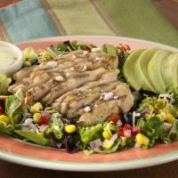Southwest Chicken Salad · Warm, marinated and grilled chicken breast served atop freshly mixed greens, our black bean ...