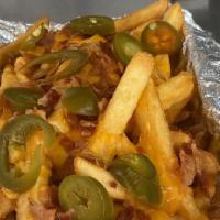 Bacon Cheese Fries · Generous portion of crispy fries, bacon, sharp cheddar or mozzarella cheese, pickled jalapeños