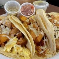 Breakfast Tacos · Breakfast Tacos – 7.5” Flour tortilla generously filled with: D5 Eggs, cheese, potatoes or b...