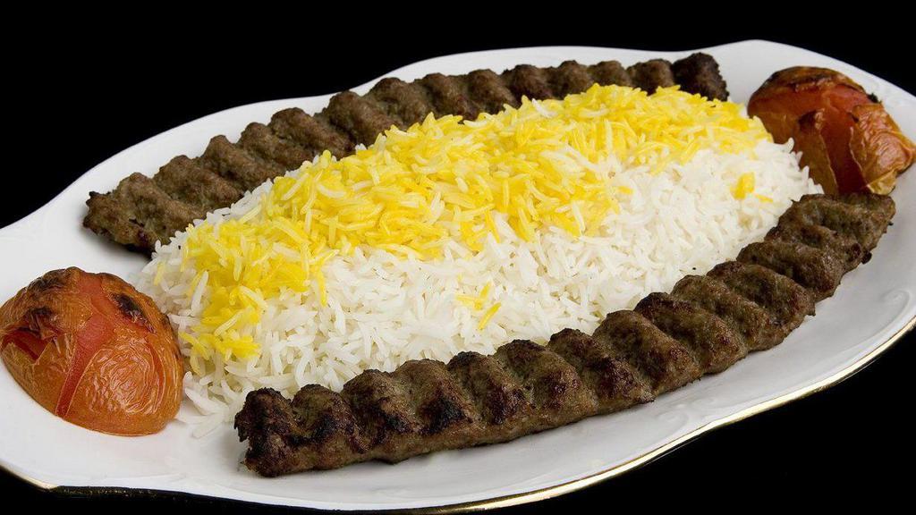 Kobideh Kabob · Two skewers ground beef, grated onion with seasoning and grilled tomato served with rice or bread.