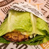 Protein Burger · Grilled beef patty with cheese, tomato and house coleslaw wrapped on iceberg lettuce.