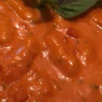 Gnocchi Alla Vodka · Our famous homemade potato gnocchi in a pink vodka sauce with shallots, fresh tomatoes and a...