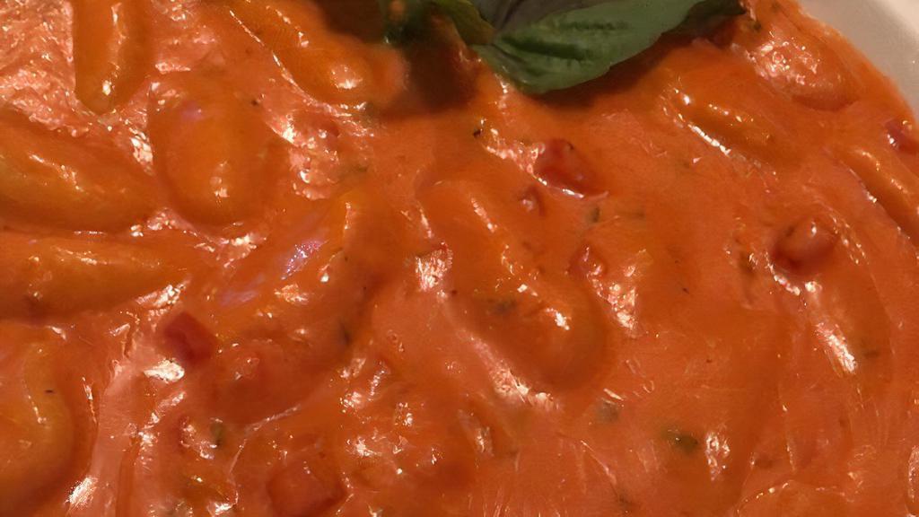 Gnocchi Alla Vodka · Our famous homemade potato gnocchi in a pink vodka sauce with shallots, fresh tomatoes and a touch of cream