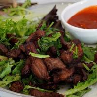 Nua Dad Deaw (Beef Jerky) · Deep fried marinated beef, served with Spicy siracha sauce
