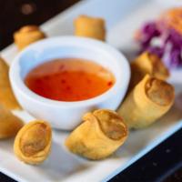 Thai Spring Rolls (4 Pcs) · Crispy fried spring rolls stuffed with vegetables, served with sweet & sour sauce.