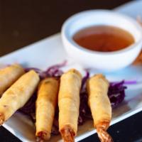 Bangkok Shrimp (5 Pcs) · Deep-fried shrimps wrapped in rice sheet, served with sweet & sour sauce.