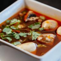 Tom Yum Gai* · Spicy. Thai style spicy and sour chicken soup with mushroom, infused with kaffir lime leaves...