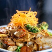 Pad See Ew · Sautéed choice of meat with flat, rice noodles, with broccoli, carrots, and eggs with sweet ...