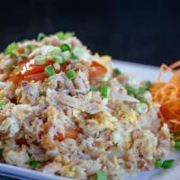 Crabmeat Fried Rice · Thai style fried rice with tomatoes, eggs, and onions with crab meat.
