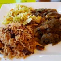 Curry Goat · Tender goat meat seasoned with our authentic Jamaican curry and simmered in a smooth sauce.