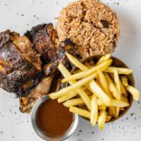Jerk Chicken · Our flagship meal. Bone-in chicken, marinated 24 hours, and smoked on our wood fire grill in...