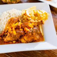 Curry Chicken · Bone-in chicken, marinated, and cooked to perfection in authentic Jamaican curry.