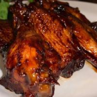 Jerk Wings With Fries · Chicken wings, fried and glazed with one of our specialty sauces: jerk, mango jerk, or jerk ...