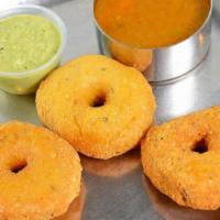 Maidu Vada (3) · Three fried lentil donuts, served with our sambhar (lentil soup) and our coconut chutney.