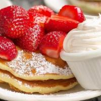 Half Order Fresh Strawberry Pancakes · Buttermilk pancakes topped with fresh sweet strawberries, dusted with powdered sugar, served...